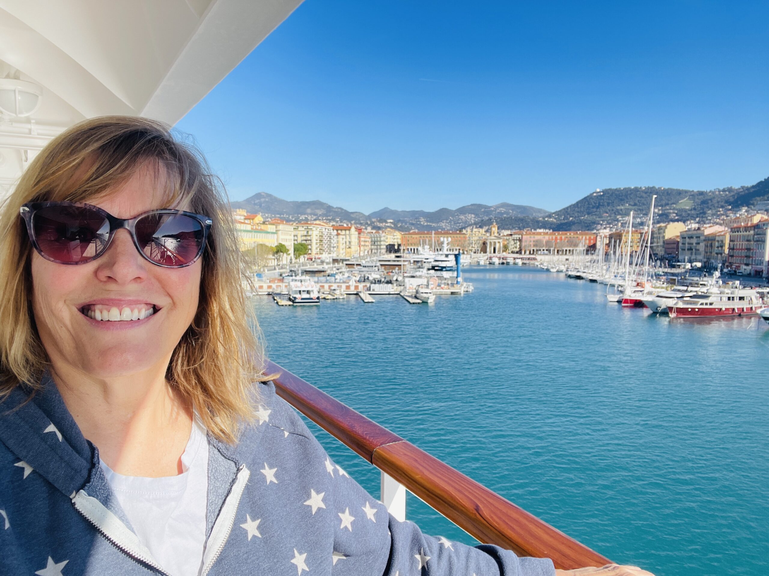 Standing on a cruise ship in Nice, France, overlooking the French Riviera.